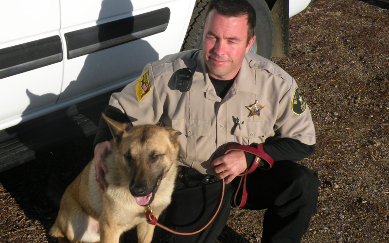 Deputy Sheriff Shane Mentzer is shown with the new K9 drug dog that joined the local law enforcement agency last week. Mentzer has been designated the permanent handler/caretaker of the  Belgian Malinois / German Shepherd mix that comes compliments of the South Dakota Attorney General’s Office and a state grant from the drug fund. TRUE DAKOTAN FILE PHOTO