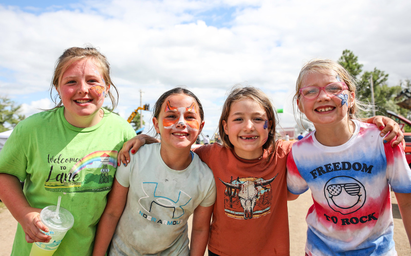 Smiling after getting their faces painted by local artist Kenzee Schafer, Quinn Everson, Hadley Weber, Austen Bultsma and Hayden Bultsma show off their custom designs.