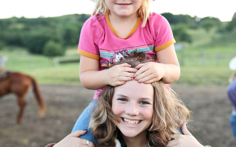 Jana Wilde catches a rode with Jalene Reiner at the rodeo.