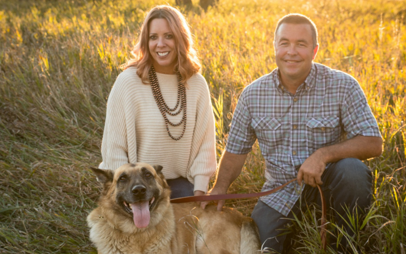Angie and Shane Mentzer family portrait with Ajax. PHOTO COURTESY MENTZER FAMILY