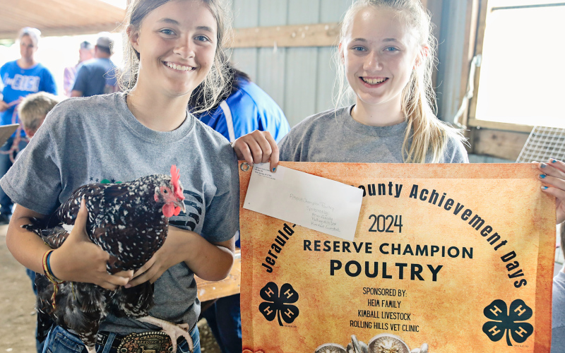 Kaycee Scheel and Tenley Olinger pose for a photo during Achievement Days