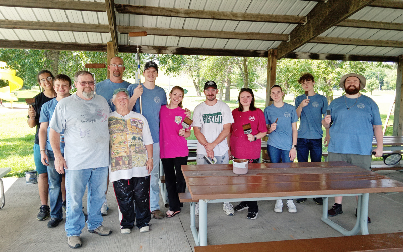 PHOTO SUBMITTED Lester and Eva Voorhess (front left) are shown with out of town volunteers who made recent improvements at the city park picnic shelters.