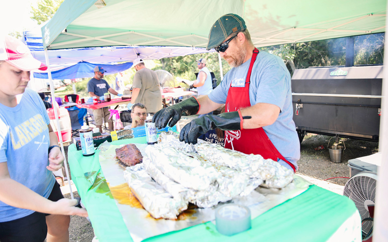 Laura and Thad Jacobson work on their first-place winning ribs.