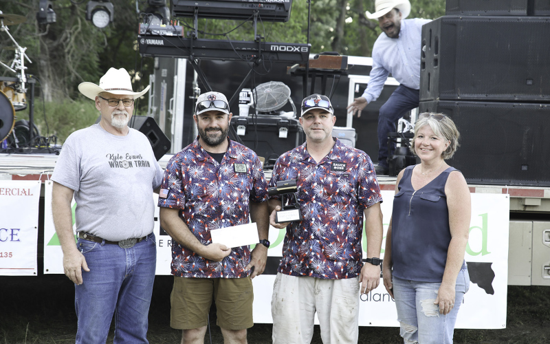 Regulars at Rockin’ Ribfest, the team of Jarrod Bultsma and Jason Weber won the People’s Choice award. Tim Deats of Dustin Evans and the Good Times Band can be seen in the background. Photos of all contestants in action can be found in this week’s print and e-edition on PAGE TEN