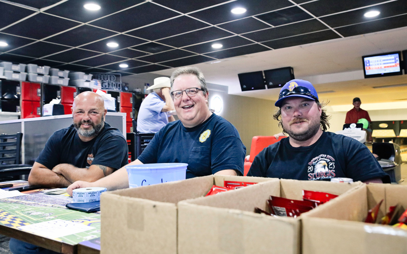 Mike Roti, Scott Vaske and Bailey Willman sold 50/50 tickets during the community event.