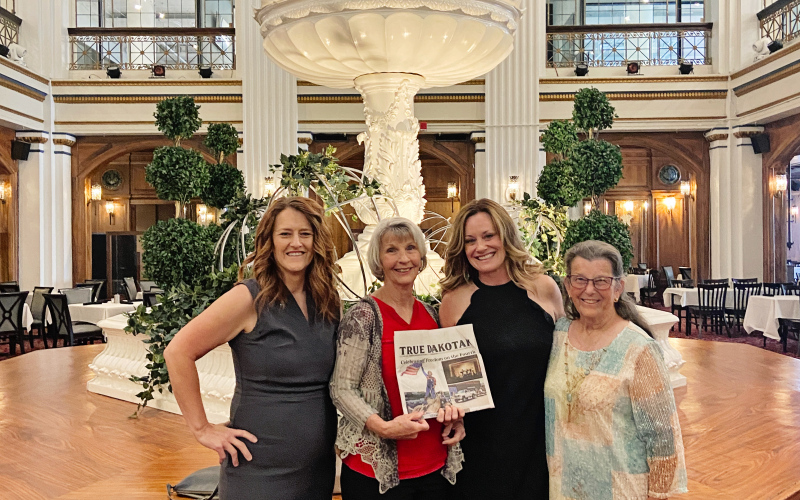 Pictured left to right are Damm, Atkinson, Hine and Ferguson just before sitting down to dine at the world-famous Walnut Room located inside Macy’s on Magnificent Mile.