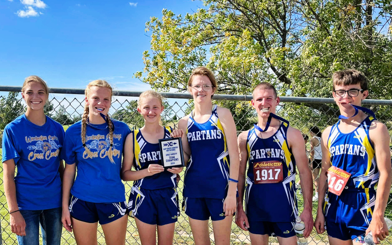 Girls Varsity brought home the first-ever team championship plaque in the MVP Cross Country Invitational last Wednesday. Shown left to right are members of the Spartans Cross Country team: Bailey Yost, Ella Kolousek, Alexis Roesler, Masynn Mebius, Sam Welsch and Ranick Fjerstad. PHOTO COURTESY BECKY KRUEGER