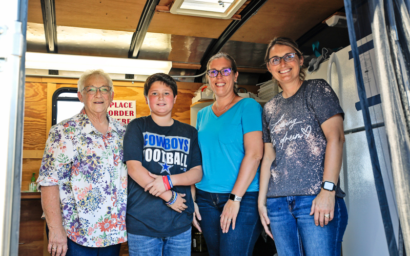 The Bull bash hinges on good food and volunteers from area churches kept the crowd well fed and happy throughout the evening. Shown left to right are: Pam Hainy, Caleb Van Dyke, Amy Linke and Becky Krueger.