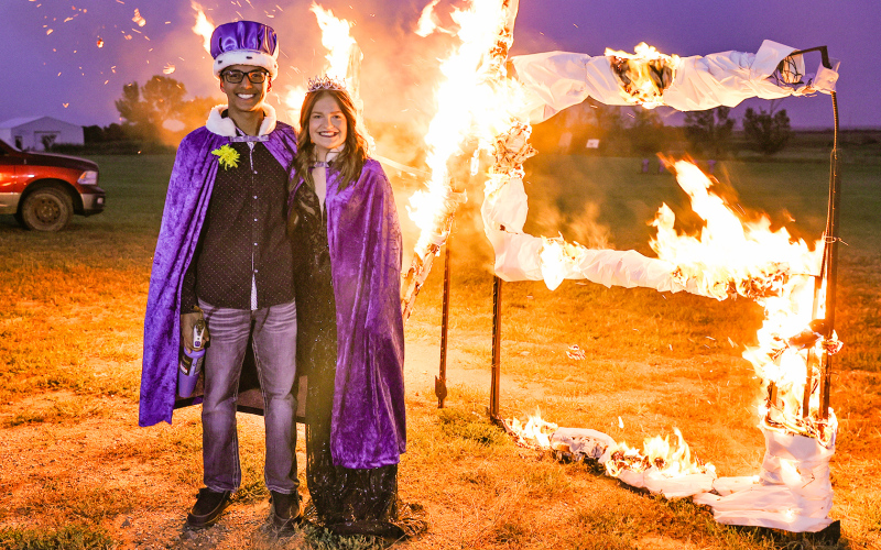 Homecoming King Richard Cardona and Queen Kennedy Kolousek at the “burning of the WS” at coronation.