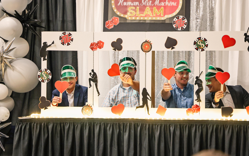 Over 200 local and out-of-town attendees filled the Springs Rec Center Saturday night for the Build Springs Gala, “Pitches and Poker.” The Vegas-themed event served as a fundraiser for improvements at the amateur/teener and little league baseball complexes in Wessington Springs. Springs Owls players served as human slot machines as part of the entertainment. Shown left to right are Cade Mohling, Mason Schelske, Camden Jost and Cale Mohling. KRISTI HINE / TRUE DAKOTAN
