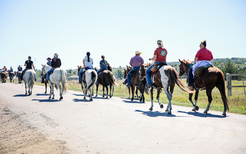 While the grandeur of horse-drawn wagons are quite a sight, the dozens of wagon train attendees on horseback make up an important part of the annual wagon train.
