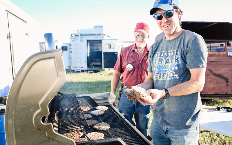 WS Church Concession Group volunteers Drew Kraft and Hub Kieser were on grilling duty Friday evening at camp.
