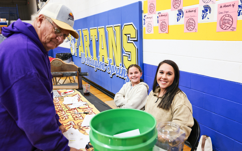 Cristin and Hadley Weber try to evoke a smile out of Kelly Larson.