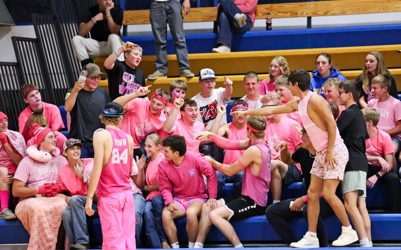 Decked out in pink, the student section cheers on the Lady Spartans during Volley for a Cure.
