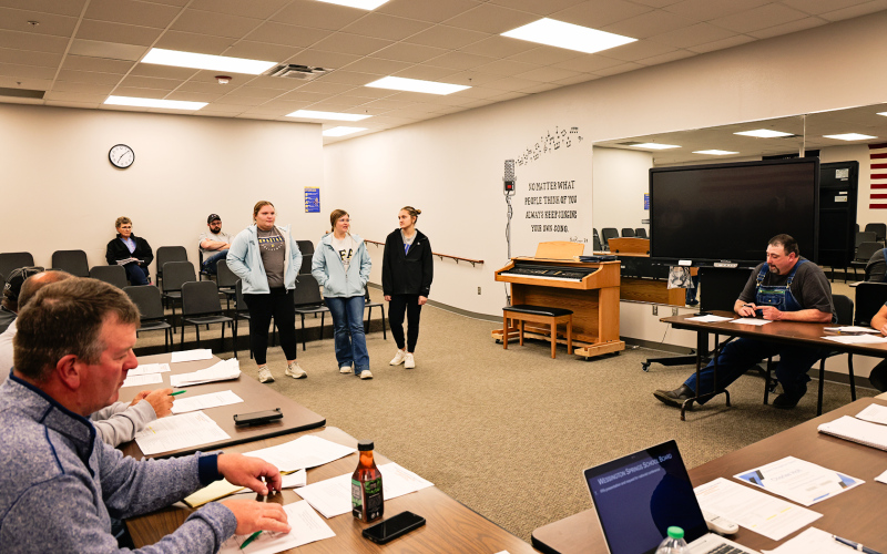 Wessington Springs FFA Floriculture team members Anna Arhart, Mercedes Jones and Mariah Messmer present information about their upcoming trip to the national convention to the school board Monday evening.