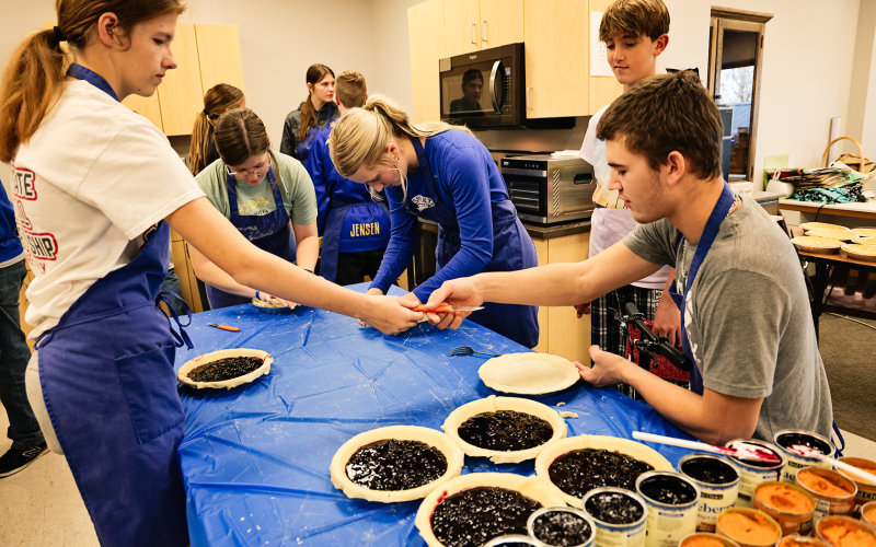 Many hands make light work as pie baking was well underway Tuesday.