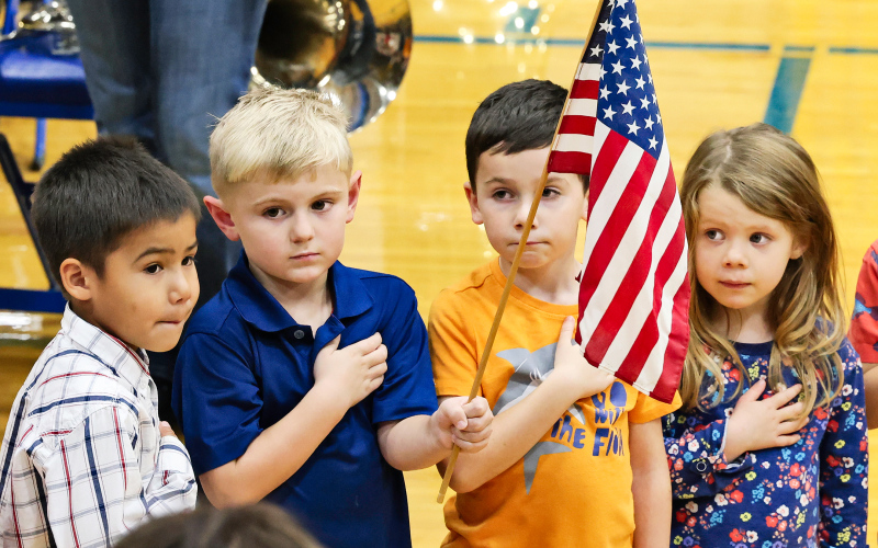 Pre-K students Kooper Argo, Eastyn Waters, Kase Van Dyke, Zoe Duxbury helped lead the crowd in the Pledge of Allegiance.