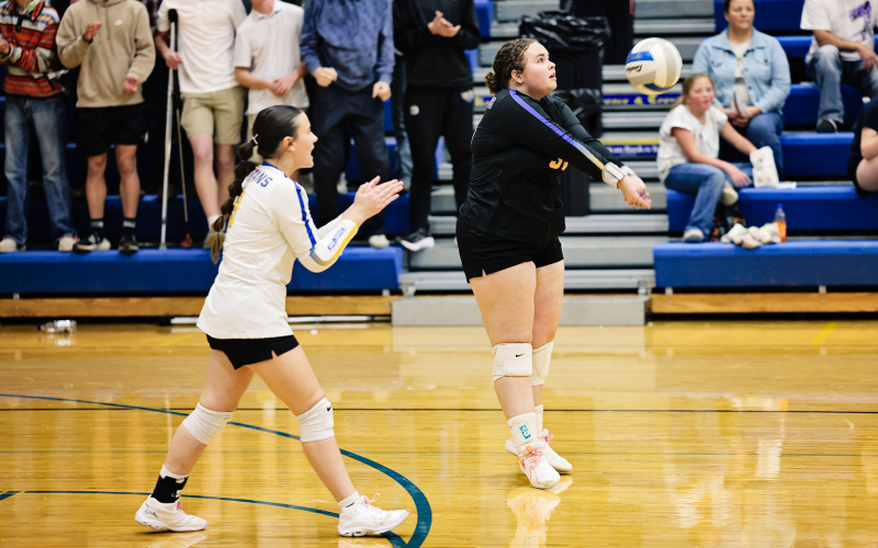 Taylor Braun lines up for a bump as Remie Roduner cheers her on.