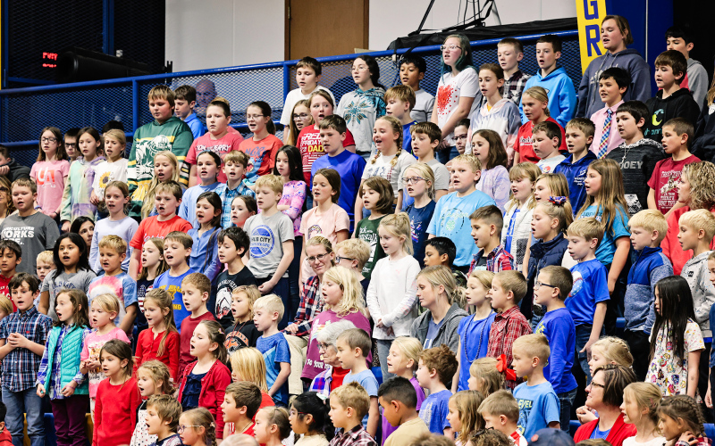 The K-6 student body sang “Our Troops and Veterans” together.