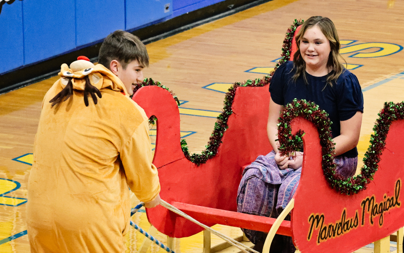 Josie Arhart was taken on a marvelous, magical sleigh-ride courtesy reindeer Brett Miller during the elementary school musical.