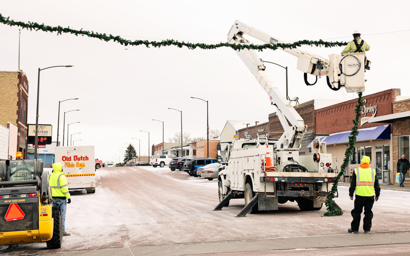 Just in time for Tuesday’s Holiday Spectacular, City of Wessington Springs employees hung the town’s beloved Christmas garland across Main Street East on Monday, December 2, 2024. KRISTI HINE / TRUE DAKOTAN