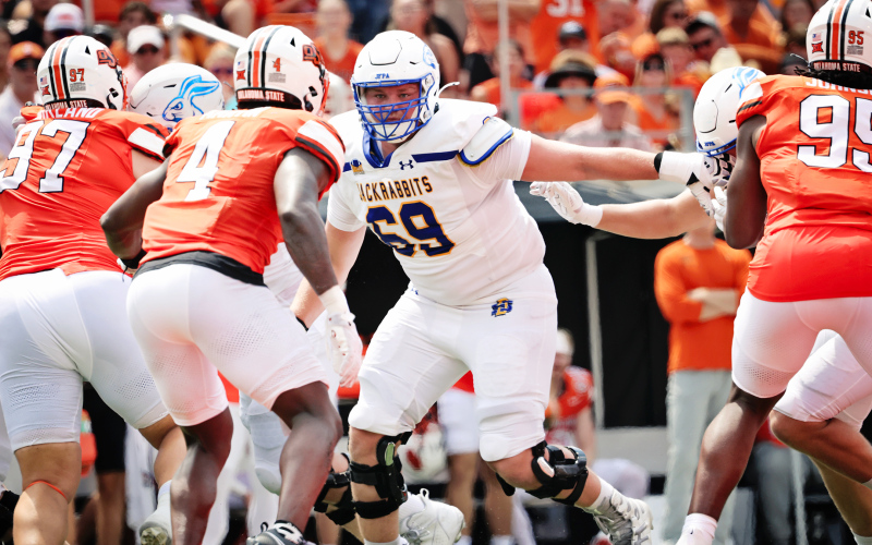 SDSU offensive tackle Quinten Christensen (69) is shown above in the Jackrabbits week one matchup on Aug. 31, 2024 against Oklahoma State. During that game, he incurred a core injury and recently underwent surgery (see editor’s note below). Christensen and QB Chase Mason played an integral role in encouraging teammates and recruits to stick with the SDSU program during coaching staff changes announced earlier this month. DAVID BORDEWYK, SOUTH DAKOTA NEWSMEDIA ASSOCIATION