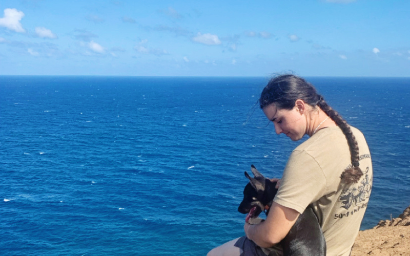 Class of 2023 WSHS alumna Sarah Poncleow on Hawaiian island Molokai with her poi dog, Moose. Poncelow secured a job last fall working as a ranch hand at the Pu’u O Hoku Ranch. PHOTO COURTESY SARAH PONCELOW