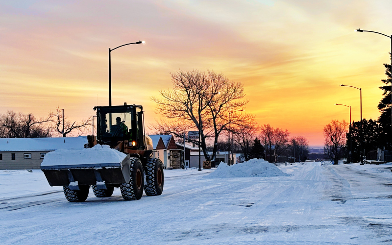 City of Wessington Springs crews were clearing streets against the backdrop of a vibrant sunrise Tuesday morning after the area received 2 inches of snow Monday February 10, 2025.