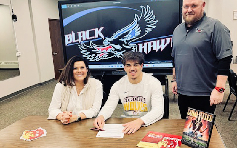 Shown left to right during a letter of intent signing with Northern State University are Becka Havlik, Holden Havlik and Head Blackhawks Coach Michael Schmitz. Holden Havlik signed to play quarterback at Northern State University. PHOTO COURTESY BECKA HAVLIK