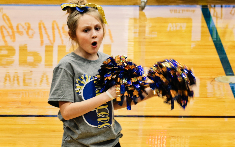 With a determined expression, Tatum Powell inspires the audience to cheer along with the Sparklers.
