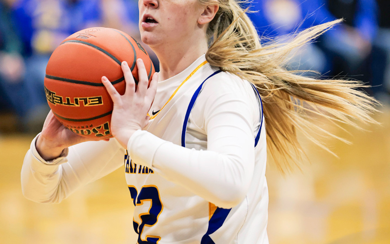 Raygen Teveldal is shown setting up for a pass. She drained two three-pointers during the home game.