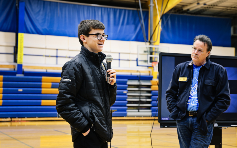 Ranick Fjerstad is shown during a school assembly with Ronald McDonald House Executive Director Kevin Miles. Fjerstad raised $3500 for the Ronald McDonald House.