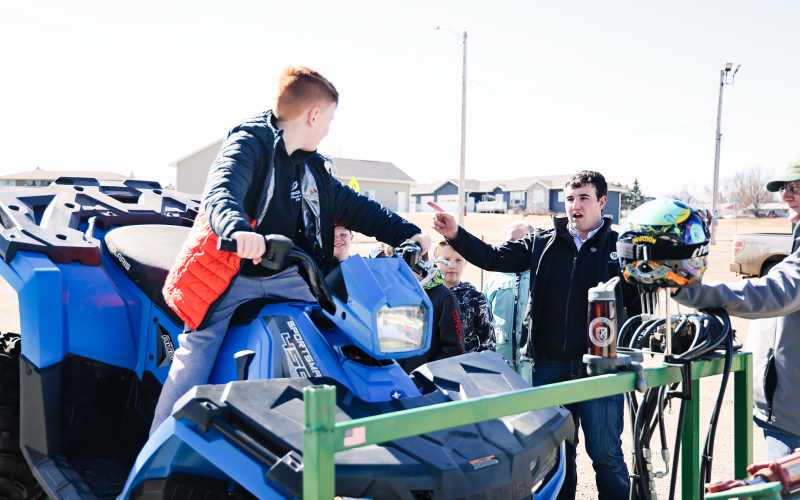 WSHS senior Ridge Roduner talks about ATV safety as elementary students take their turn on an ATV simulator. KRISTI HINE / TRUE DAKOTAN