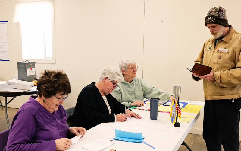 Wessington Springs poll workers (left to right) Kay Thompson, Pam Frank and Vicki Brodkorb help voter Jesse Rogers check in and receive his ballot on Tuesday, April 8, 2025. KRISTI HINE / TRUE DAKOTAN