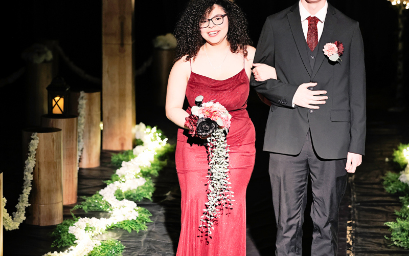 Senior Mikaela Jones is escorted by Gavin Brandenburg.