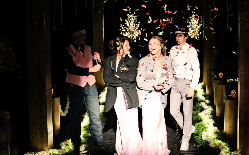 Senior Mariah Messmer is escorted by Ethan Goehring and senior Sam Poncelow escorts Ashlyn Weber.