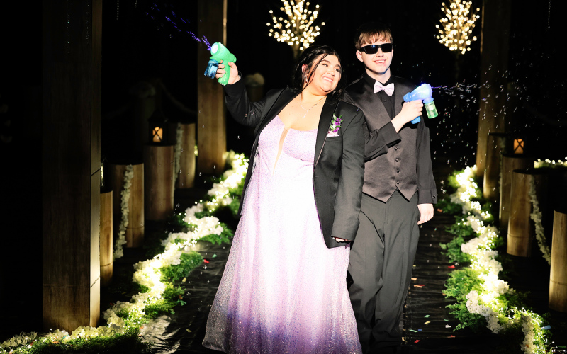 Sophomore Jerrytt Culver escorts Tierney Knipfer.