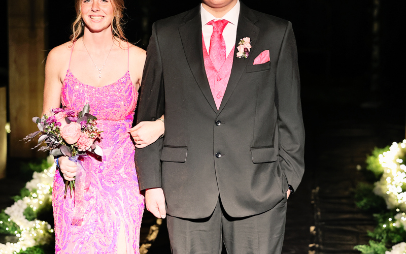 Senior Will Bruckner escorts Sydney Richardson.