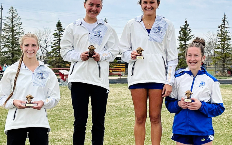 PHOTO COURTESY BECKY KRUEGER The 800m relay of Bailey Yost, Logan Mohling, Mariah Messmer, and Kenzie Kolousek combined efforts for 1:56.86 to cross the line in 1st place.