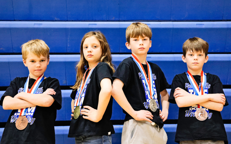 Four Wessington Springs Elementary School students and Pony Hills youth wrestlers brought home some hefty hardware from the state tournament last weekend. Shown left to right are: Kactus Coleman (6th), Mary Tanke (1st), Kaddilac Coleman (2nd) and Kix Koleman (5th). KRISTI HINE / TRUE DAKOTAN