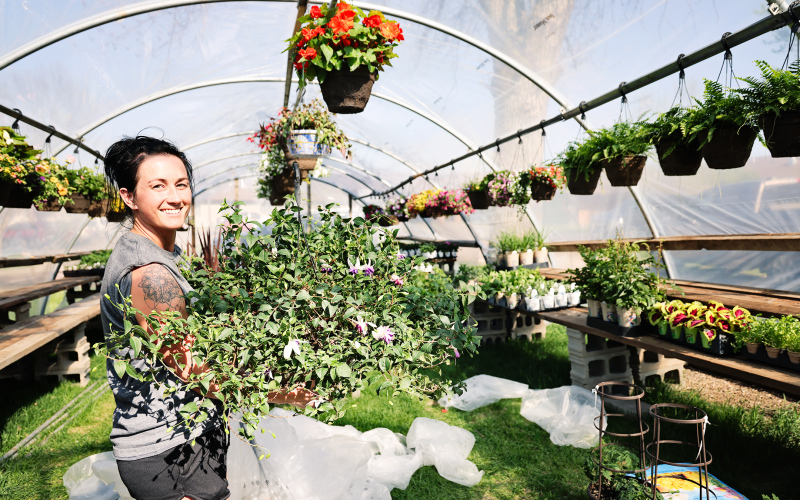 Bethany Schimke, 2nd and Bloom Flower Shop owner, recently purchased the seasonal floral and plant greenhouse formerly known as Petal Pushers from Wessington Springs resident Tony Aldrich. She is pictured  on Sunday, May 4, 2025, unloading a trailer of plants, hanging baskets, vegetables and many other garden goodies that will be available for sale beginning May 10, 2025.