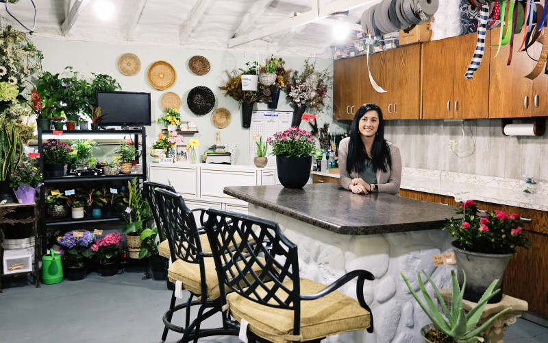 Schimke is shown in her newly renovated flower shop and design room located on 2nd and Slocum Ave, adjacent to the recentlyconstructed greenhouse.