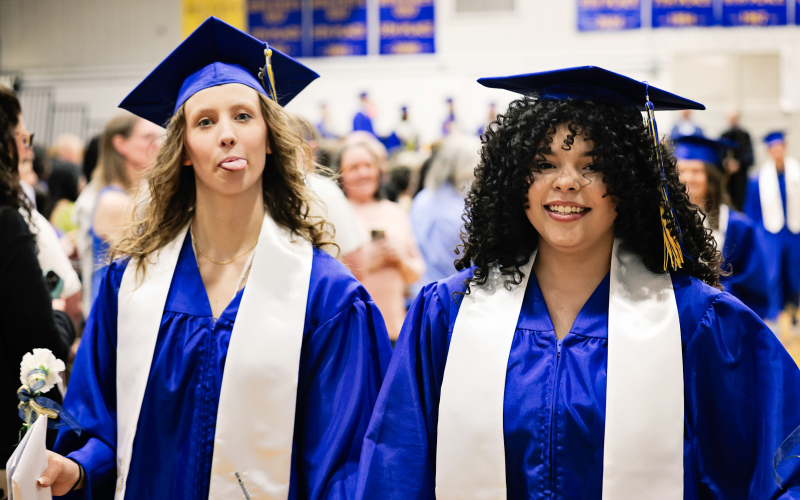 Jaclyn Jungemann and Mikaela Jones have some fun during the recessional.