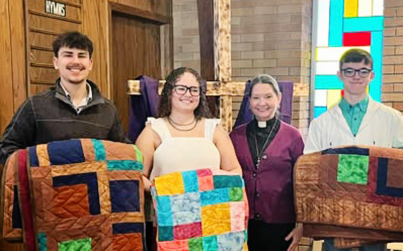 Our Savior’s Lutheran Church honored WSHS graduates Blake Miller, Taylor Braun and Ranick Fjerstad with handmade quilts. They are shown with Pastor Nancy Rieke.