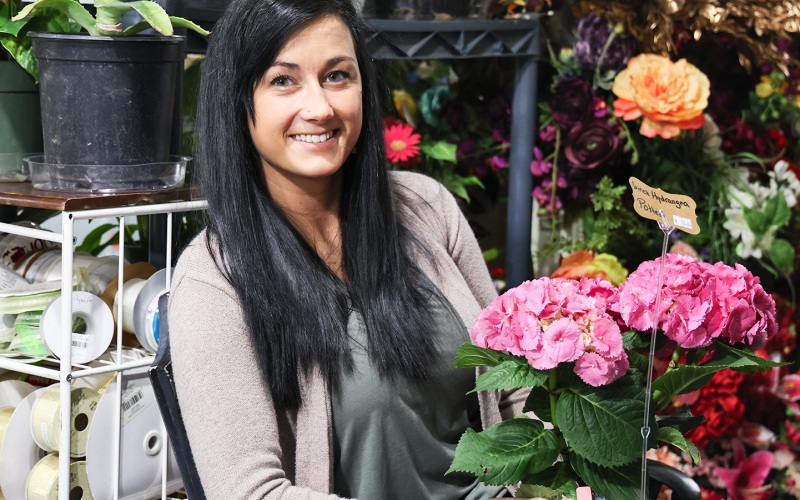 Schimke is shown in her newly renovated flower shop and design room located on 2nd and Slocum Ave, adjacent to the recentlyconstructed greenhouse.