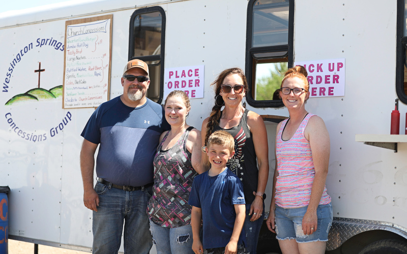 TRUE DAKOTAN FILE PHOTO Church concessions volunteers Bernard and Reina Ford, Christina and Maverick Roduner and Leslie Tanke took a quick break from serving up hungry rodeo fans and contestants during the July 2021 Foothills Rodeo.