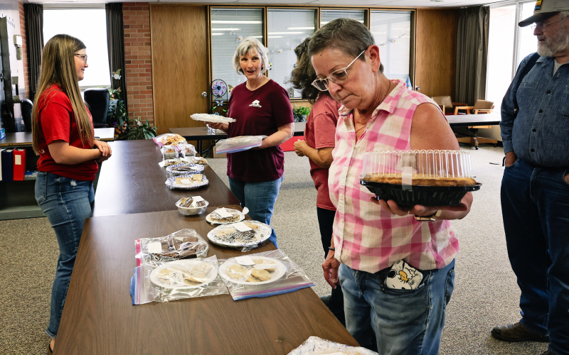 WSHS FCCLA member Mercedes Jones (left) helps hungry customers Delia Atkinson, Jean Ferguson, Carla Niemeyer and Tom Dean at a bake sale held Friday, June 13 at city hall. Proceeds from the bake sale will go toward funding a trip to the National FCCLA Leadership Conference in Orlando.