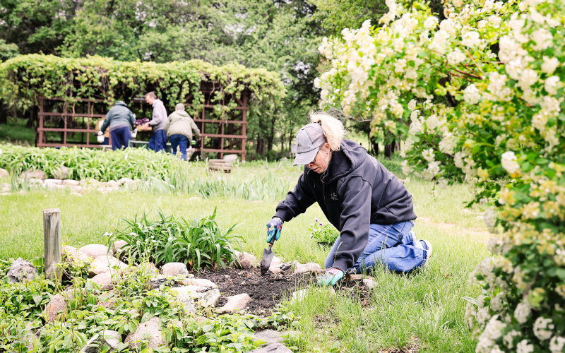 Wessington Springs woman Angie Mentzer works the dirt just north of the fish pond. She and husband Shane have taken on the pond-tending role for the past several years, ensuring that the pond is clean for the fish once they return from their winter home.