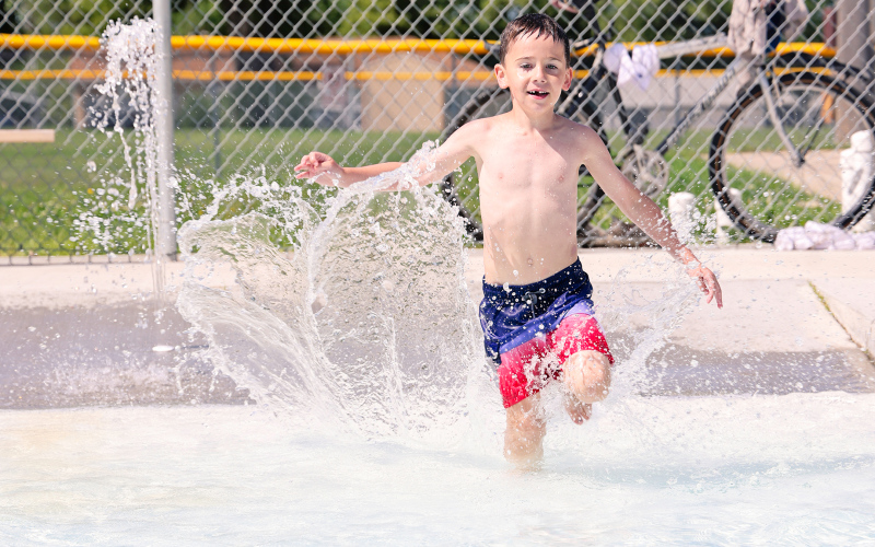 Kase Van Dyke splashes into the wading pool via the zero-entry on Monday, June 16, 2025.