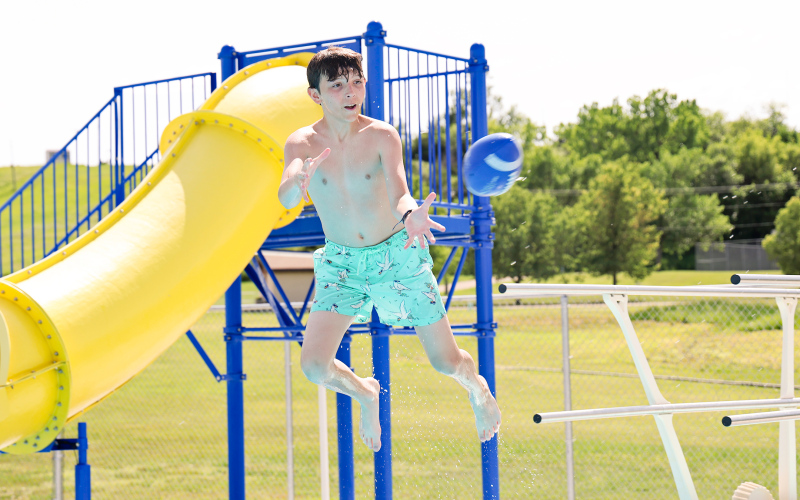It’s Oakley Thompson’s turn to fly off the diving board and catch the football, thrown by Lorin Schaller. Thompson, a resident of Tea, SD, was in Wessington Springs visiting his grandparents Dave and Janice Bender and enjoyed Monday afternoon at the pool.